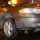 An image of the Buick on jack stands after the fix.